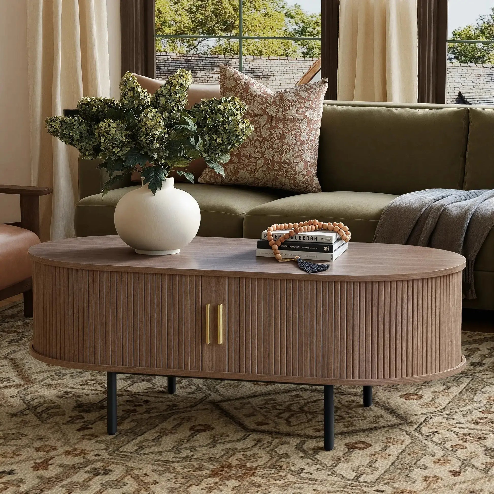 Win2Win_Oval_Coffee_Table_with_Storage_Walnut_Fluted_Center_Table_in_a_living_room_setting_paired_with_a_sofa_and_decorative_greenery